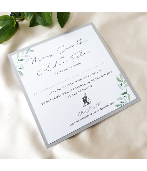 Luxury wedding invitation samples featuring olive leaves and premium stationery finishes.