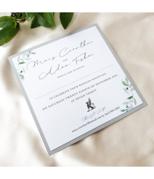 Luxury wedding invitation samples featuring olive leaves and premium stationery finishes.