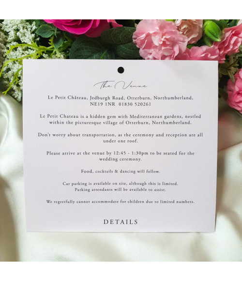 Elegant script typography printed on soft pink wedding stationery