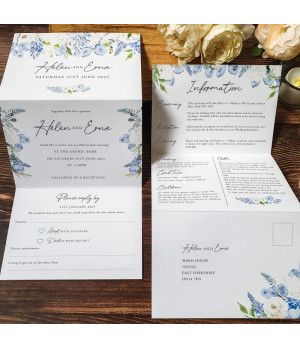 Dusty blue wedding invitation opened to show the ceremony details and additional information panels.