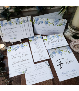 Dusty blue floral wedding stationery featuring Save the Date invitation Order of Service menu place name card and table name.