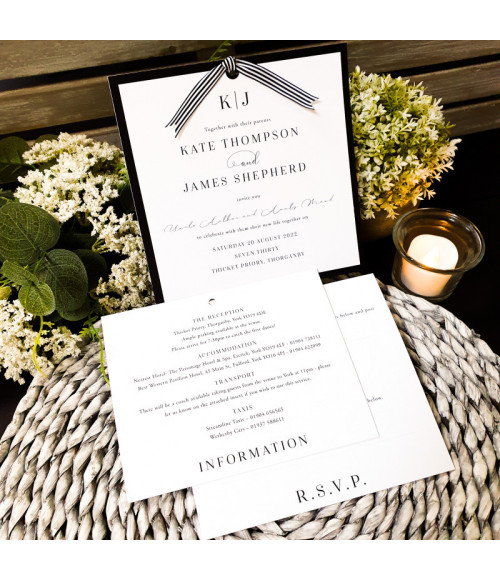 Modern black wedding invitation with striped ribbon fastening and luxury finish