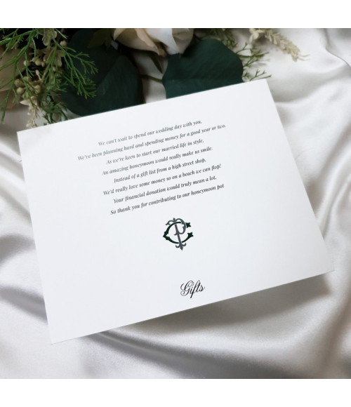 Close-up of forest green wedding invitation with textured card and personalised print
