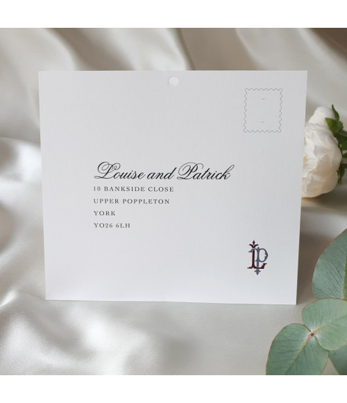 Romantic dusky pink wedding stationery featuring a bespoke monogram design.