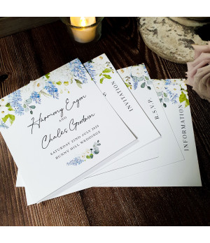 Elegant personalised wedding invitation with soft blue floral artwork.