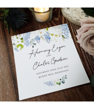 Botanical wedding invitation suite with romantic dusty blue details.