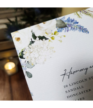 Personalised wedding invitation suite with matching floral stationery details.