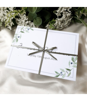 Wedding invitation, concertina fold with olive leaves and branches ties with a sage green ribbon and postcard rsvp card