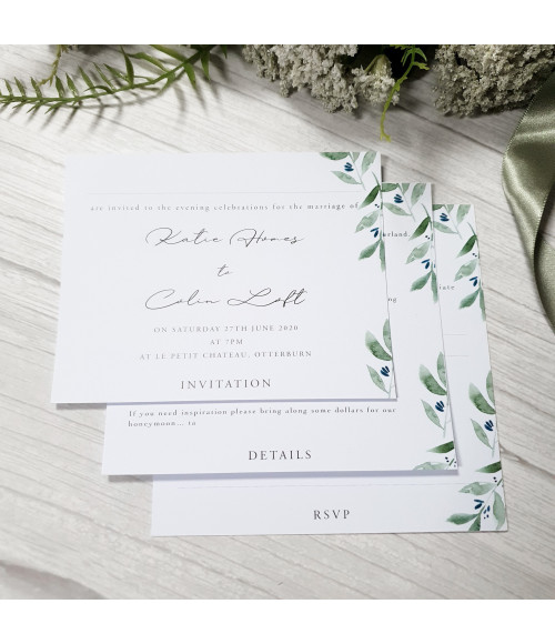 Luxury white wedding invitation with olive leaf foliage and satin ribbon