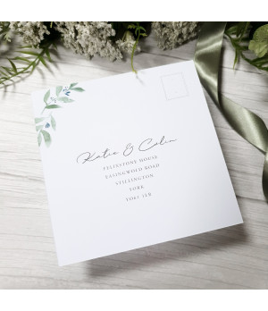 Coordinated wedding RSVP card with botanical greenery design