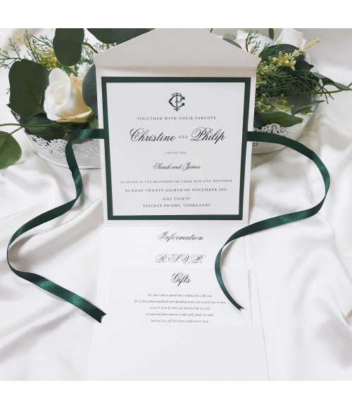 Pocket wedding invitation in forest green with mounted invite, personalised guest names and neatly arranged insert cards