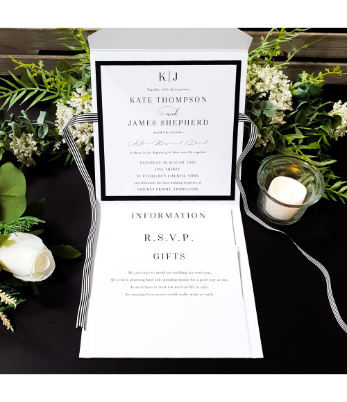 Premium black and white wedding invitation set with coordinated RSVP and details cards