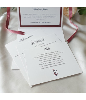 Premium pearl white and dusty rose wedding invitation with personalised details.
