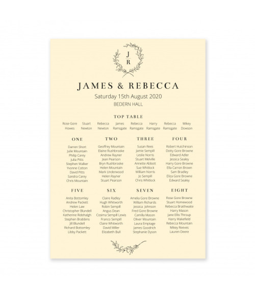Cream wedding table plan with personalised guest seating and elegant wreath monogram design