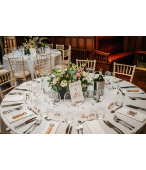 Personalised wedding place cards featuring delicate peony flowers and elegant typography