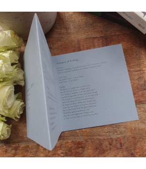 Dusty blue wedding invitations paired with elegant typography and premium finishes