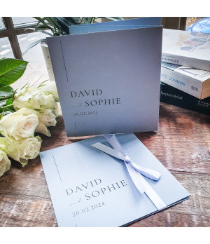 Elegant dusty blue wedding invitation featuring personalised details for your special day