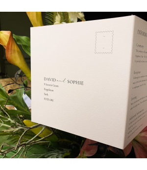 Close-up of a personalised pink wedding invitation showcasing premium print quality and elegant typography.