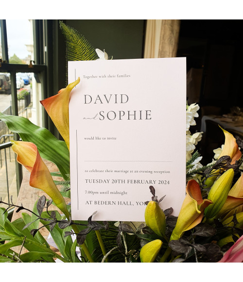 Beautiful soft pink evening wedding invitation designed for a romantic wedding reception