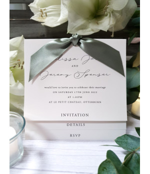 Sage green wedding invitations styled for a romantic and natural wedding theme