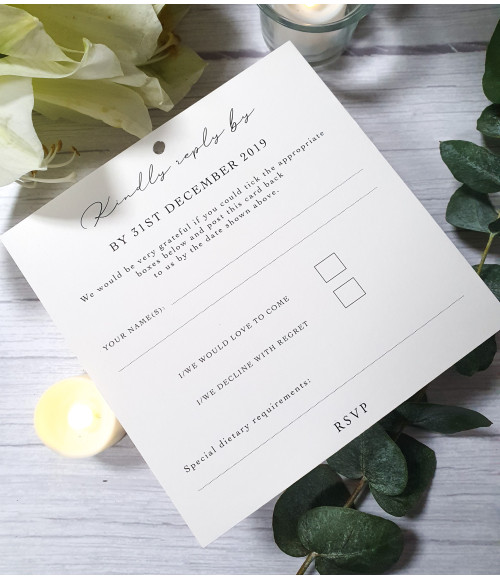 Wedding invite with ivory card and old rose pink ribbon, featuring an RSVP postcard and detailed information card