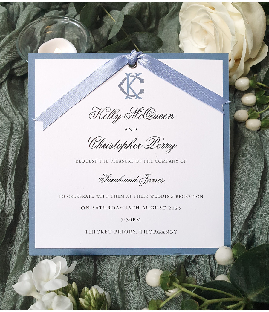 Luxury dusty blue evening wedding invitation with satin ribbon and personalised monogram design