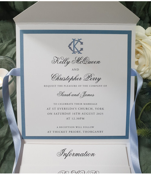 Pocket wedding invitation in slate blue with layered inserts, personalised details and elegant script typography