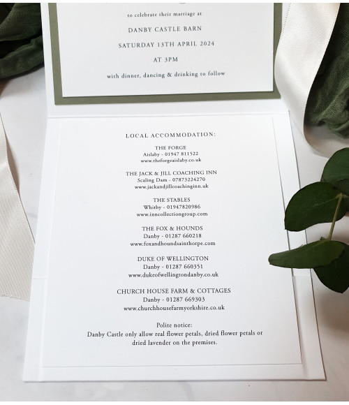 Sophisticated white floral wedding invitation folder with RSVP postcard and matching detail cards