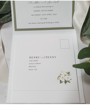 Elegant UK wedding stationery set with white rose motif and timeless classic wedding design aesthetic