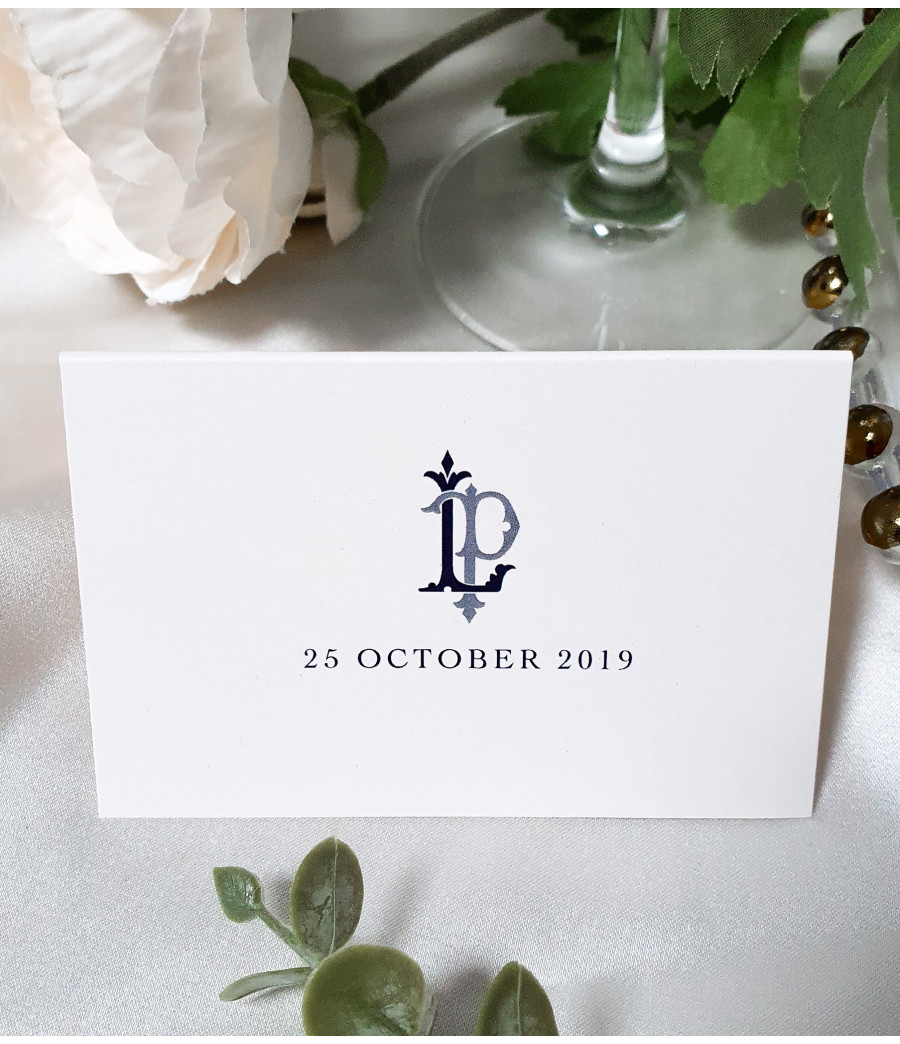 Personalised navy blue wedding place name cards printed on luxurious pearl white card.