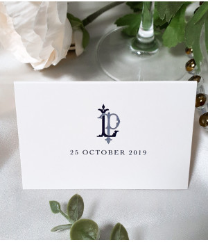 Personalised navy blue wedding place name cards printed on luxurious pearl white card.