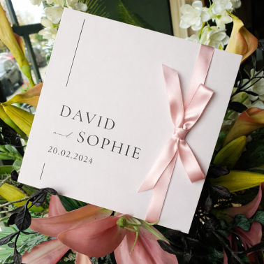 Personalised pink day wedding invitation featuring an elegant floral design and luxury wedding stationery finish.