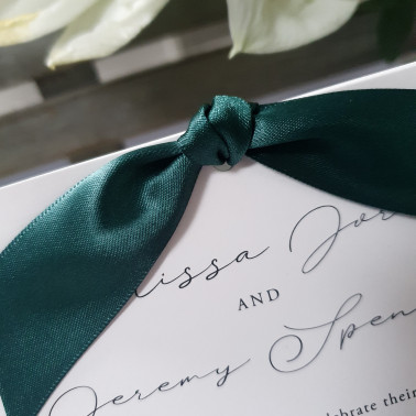 Elegant emerald green wedding invitations with satin ribbon for a timeless finish