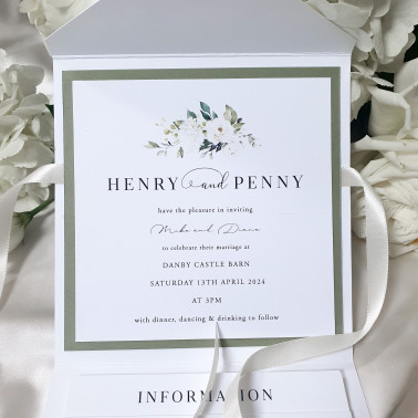 White rose floral wedding stationery suite with layered inserts and refined premium presentation folder