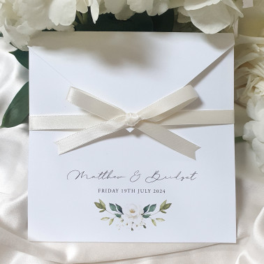 Luxury white rose wedding invitation suite featuring elegant floral design and personalised guest names