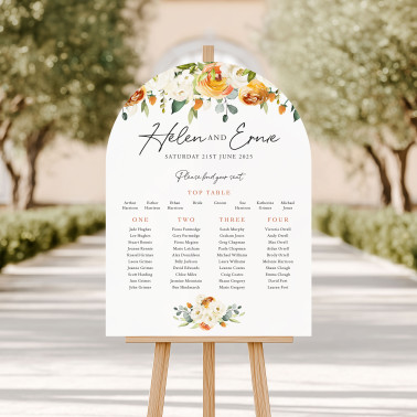 Arched wedding seating plan personalised with the couple’s names, wedding date and guest table arrangements.
