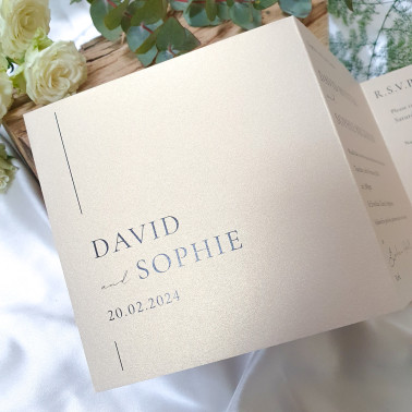 Modern concertina wedding invitation printed on champagne card and beautifully tied with a cream ribbon.