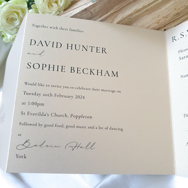 Champagne and ivory wedding invitation with a practical folding design for ceremony, venue and RSVP information.