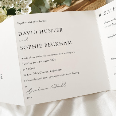 Luxury personalised wedding invitation in warm beige and champagne colours with stylish script lettering.
