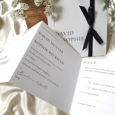 Luxury black and white wedding invitation featuring timeless monochrome styling.