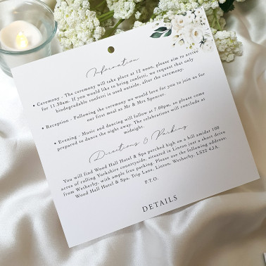 Personalised white rose wedding stationery featuring classic script typography and soft floral details