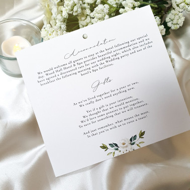 Vintage-inspired white rose wedding invitation with soft botanical accents and refined detailing