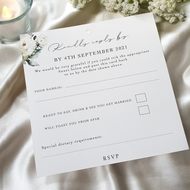 Elegant bridal stationery featuring white roses, luxury finish, and coordinated wedding suite design