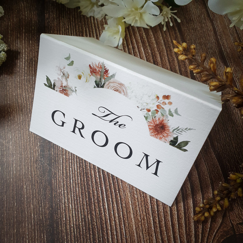 Luxury folded taupe wedding place cards with guest names, perfect for classic and modern wedding receptions.