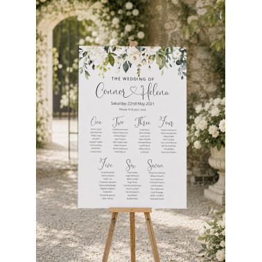 Personalised white roses wedding table plan with elegant greenery and custom guest seating details.
