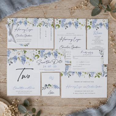 Dusty blue floral wedding stationery featuring Save the Date invitation Order of Service menu place name card and table name.