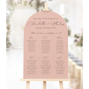 Arched blush pink wedding seating plan with elegant personalised lettering, a smooth curved top and classic table layout