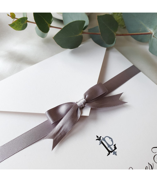 Elegant silver wedding stationery suite with RSVP card, information card, and coordinated inserts