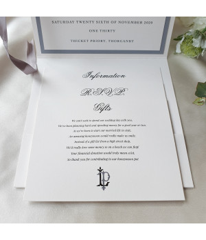 Close-up of luxury silver wedding invitation with pearl card texture and refined personalised print
