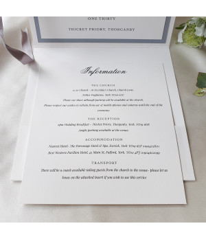 Sophisticated monochrome wedding stationery set featuring silver accents and coordinated invitation inserts